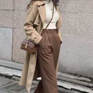 Beige Trench Coat, White Mock-neck Top aur Brown Pleated Trousers